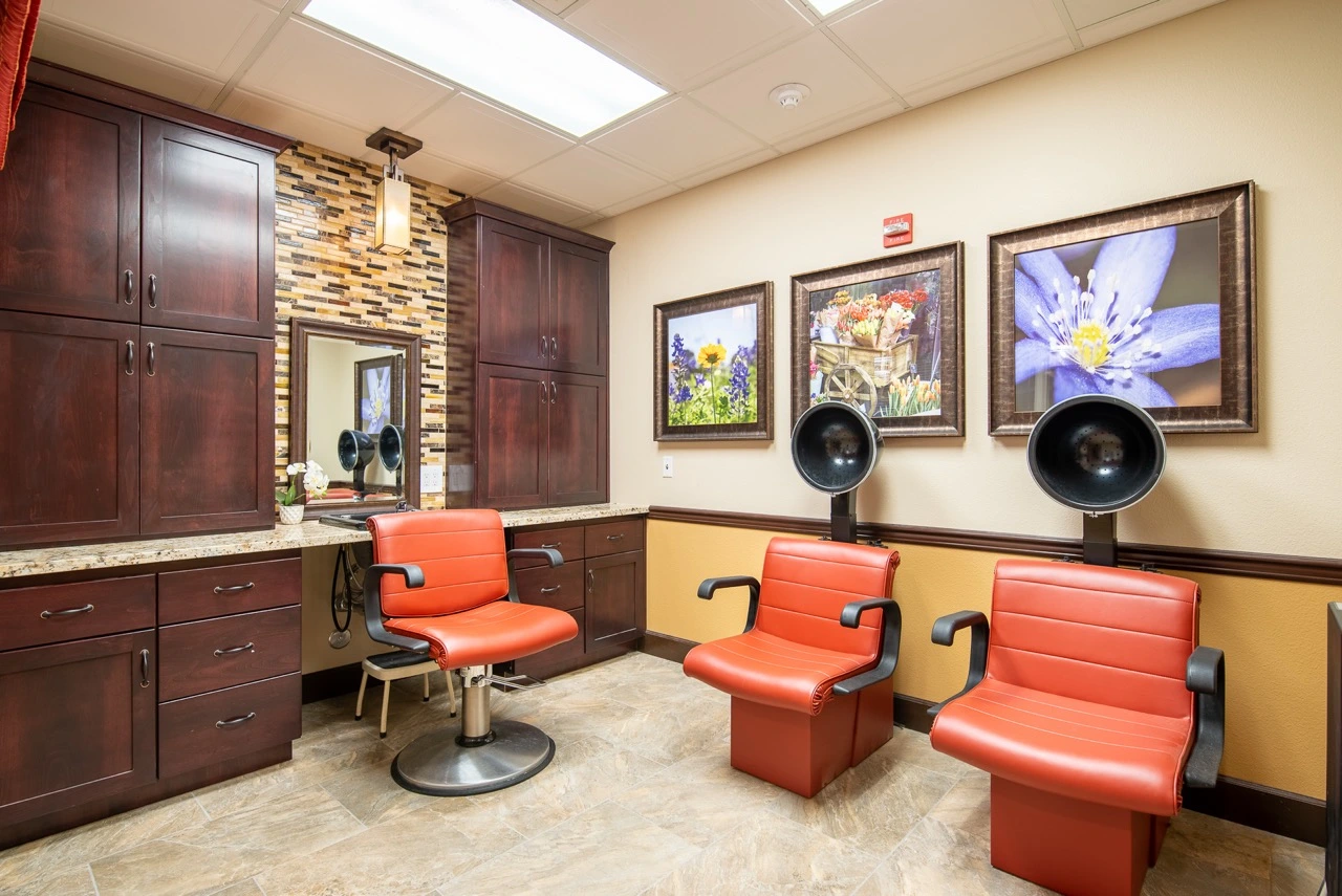 Salon and spa with three red salon chairs